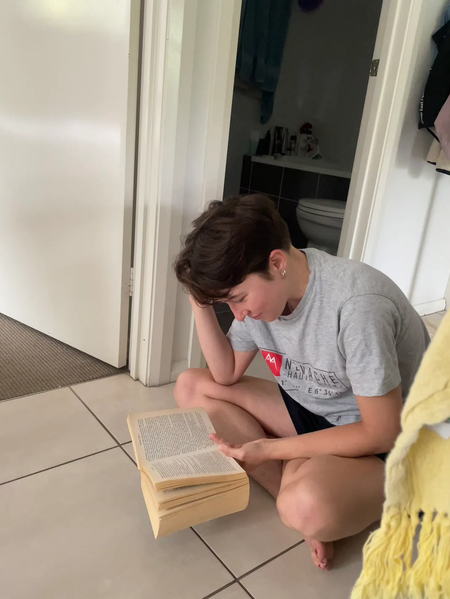 me on the floor reading a book